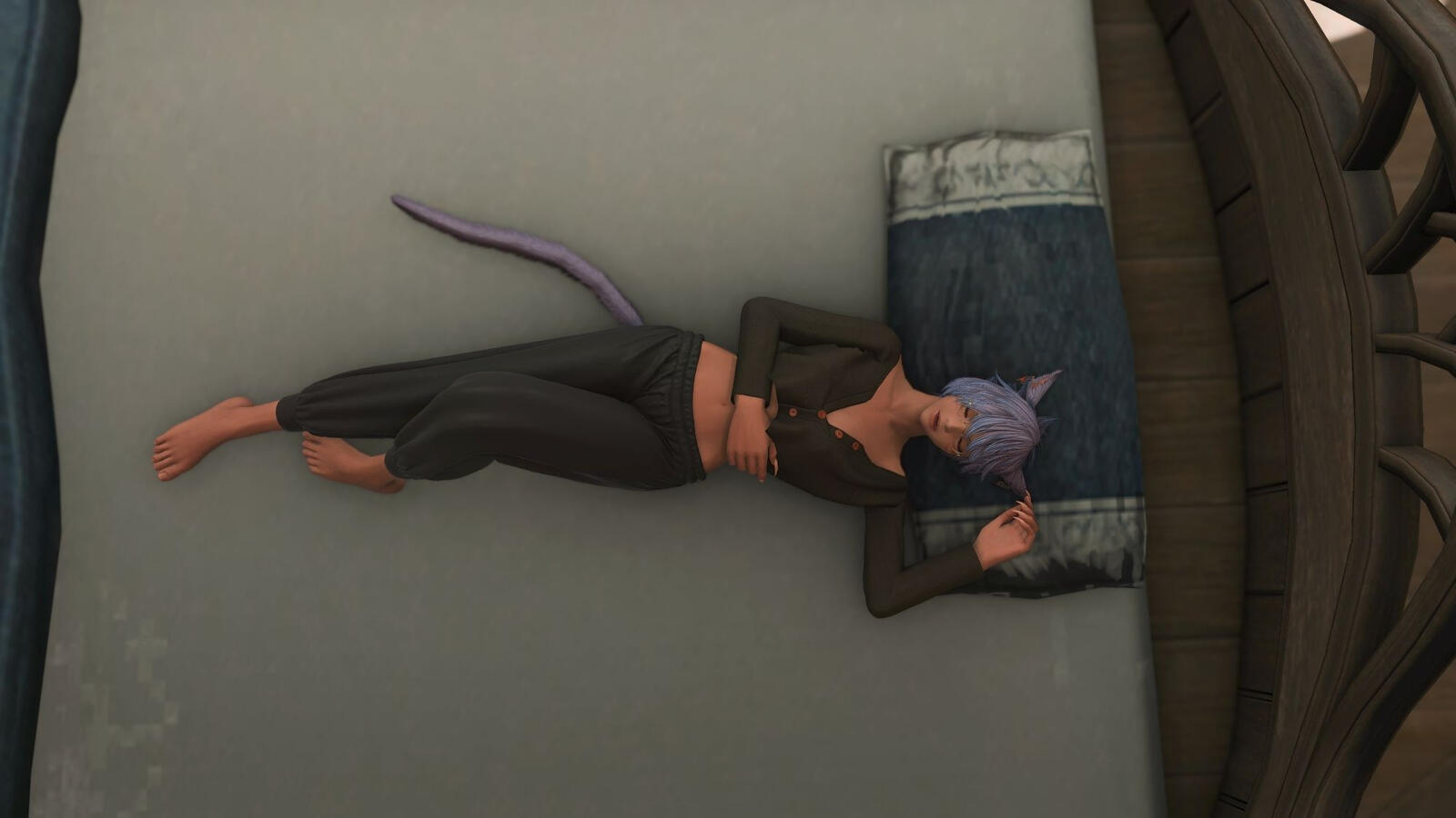 K'anra lays in bed in her pajamas, ready for bed.